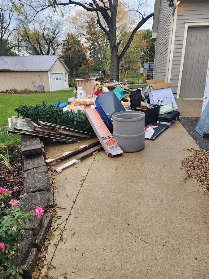 Dumpster being loaded with debris for Demolition Dumpster Rental in Baxter Springs